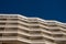 Big hotel or apartment building facade balcony pattern