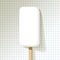 Big ice lolly icecream white on a checkered paper background.