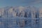 big iceberg wall behind ice plate and wooden sledge