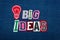 BIG IDEAS text word collage, multi colored fabric on blue denim, lightbulb, innovation concept