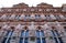 Big, important and historic building with glass windows and coats of arms in Heidelberg in Germany