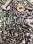 A big and interesting pile of new and shiny metal nuts and bolts, screws and washers.