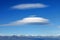 Big lenticularis cloud and snowed mountain