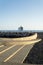 Big liner boat leaving to the horizon in a peaceful Atlantic ocean blue water, Madeira Island, Portugal