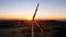 Big lonely windmill turbine peacefully rotating in the wind