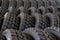 Big machines tires stack background. Industrial tires