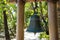 Big metal bell near restaurant entrance at tropical island