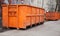 Big metal orange trash containers