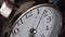 Big metallic clock close up 4k video. Time or showing time concept. Classic retro mechanical alarm clock