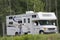 Big Motorhome with owner in the woods