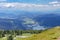 Big mountains of the Gerlitzen Alps in Austria and a lake with the horizon in the sunny background