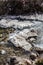 Big natural form ice on the frozen river on the moving river at Thangu and Chopta valley in winter in Lachen. North Sikkim, India