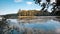 Big natural lake in forest on sunny summer midday with deep blue sky, still water surface, nature panorama tinted background photo