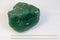 Big natural stone green amber on white background
