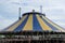 Big noname circus tent under a cloudy sky