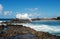Big ocean waves breaking on the natural pool. Small resort town of Bajamar, Tenerife North, Canary Islands, Spain.