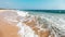 Big ocean waves crashing on a sandy tropical beach of Sri Lanka.