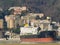 Big oil chemical tanker moored in a port next to the buildings