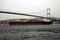 A big oil tanker passing under the bridge in the Bosphorus