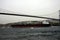 A big oil tanker passing under the bridge in the Bosphorus