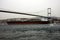 A big oil tanker passing under the bridge in the Bosphorus