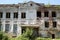 Big old brick burnt abandoned house with windows