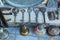 Big old keys, horseshoes and metal dishes on the counter of an antique shop