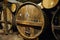 Big old oak casks of pommeau of calvados in a cellar