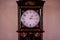 Big old vintage pendulum clock with thai pattern background at a