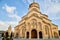 Big orthodox cathedral St. Trinity or Chirch Sameba in Tbilisi city in Georgia and blue sky background