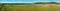 Big panoramic view of colored lines of fields