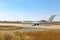 Big passenger airplane drives along the runway in airport