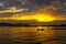 Big passenger ferry ship on sunset background in Vlore city port. Wonderful sunset on Adriatic Sea in western Albania, Europe.