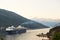 Big passenger liner in the bay. Montenegro, Boka Kotorska bay on a hot summer day.