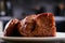 Big piece of meat on plate. Roast beef close-up. Barbecue meat in modern kitchen. Blurred background oven. Hot cooked dinner. Side