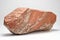 Big piece of stone isolated on white, The type of stone is red limestone