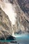 Big pieces of rocks falling into the sea