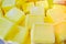 Big pieces of yellow soap with bergamot folded a bunch