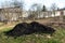 Big pile of black fertile soil. Peat chernozem. Ground for using in the greenhouse og in the garden for planting