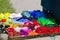 Big pile of fresh bright colorful oil paints lay in disorder on artist wooden palette, grounded canvas ready for plein air