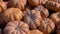 Big pile of orange pumpkins on the field during the harvest. Halloween, Thanksgiving. Pumpkin patch.