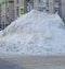 Big pile of snow removed on the street