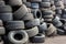 Big pile of used old car tires for recycling