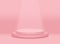 Big pink pastel round pedestal podium or stage and soft light background.The light shines down below.Love valentines day concept.