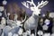 Big plush deer, reindeer, roebuck, bears and owls in snowy landscape. Winter scenery.