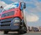 Big powerful truck in front of blue bright sky