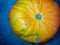 Big pumpkin on a dark background. Vegetables on the table. Preparing for Halloween. Cooking