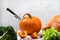 Big pumpkin with knife inside on the table