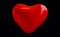 Big red heart on black isolated background. A shiny, festive balloon. 3d image for your greeting card, invitation, party,