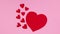 Big red heart and little hearts appear on pink theme. Stop motion valentine`s day